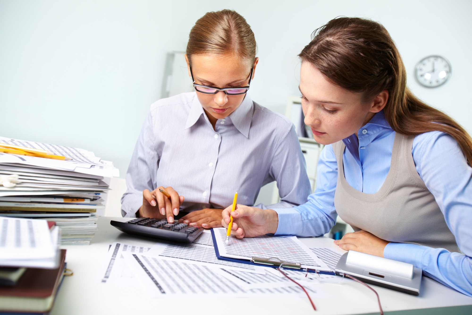 Women collaborating on bookkeeping tasks