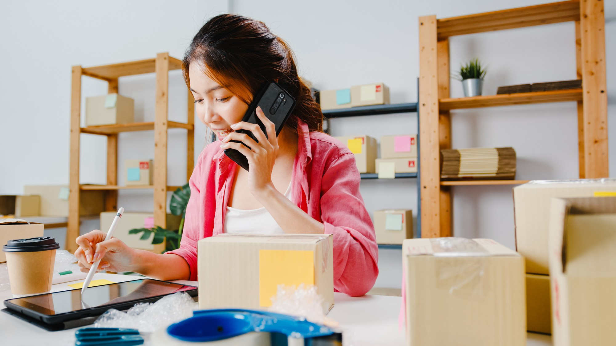 Woman managing online sales
